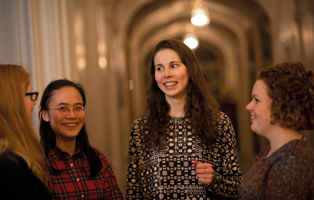 Ladies talking in a hallway